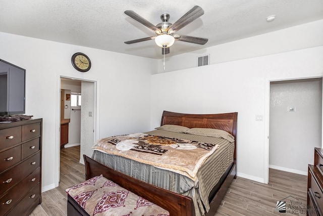 11861 E Eclipse Ct, Yuma, AZ 85367 - bedroom featuring visible vents, baseboards, ceiling fan, and light wood-type flooring