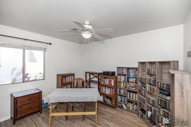11861 E Eclipse Ct, Yuma, AZ 85367 - interior space featuring baseboards, a ceiling fan, a textured ceiling, and wood finish floors