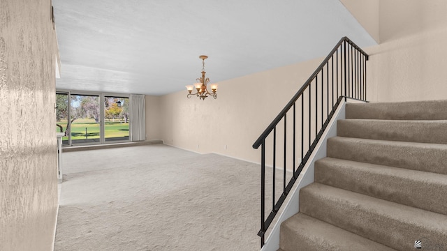 1440 E Laguna Pl, Yuma, AZ 85365 - stairs with a chandelier and carpet floors