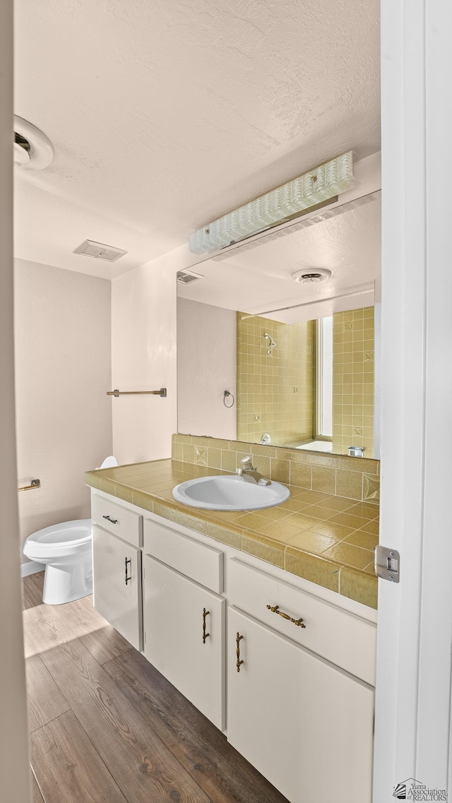 1440 E Laguna Pl, Yuma, AZ 85365 - bathroom with wood finished floors, vanity, and toilet