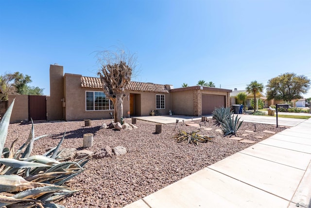 2931 W 20th St, Yuma, AZ 85364 - view of front of property with driveway, stucco siding, an attached garage, and a tiled roof
