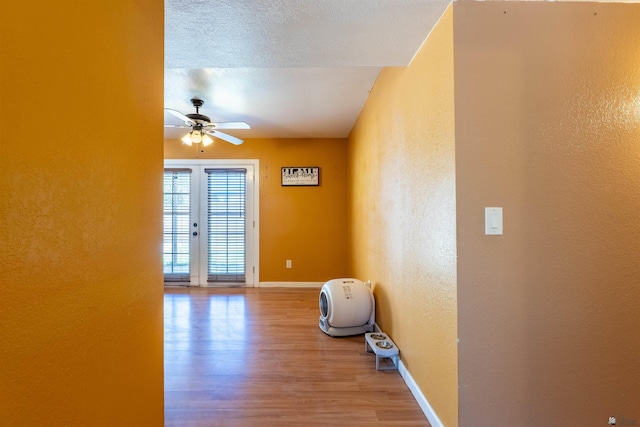 2931 W 20th St, Yuma, AZ 85364 - empty room with a ceiling fan, wood finished floors, baseboards, and a textured wall
