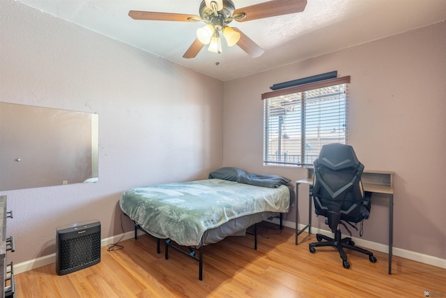 2931 W 20th St, Yuma, AZ 85364 - bedroom with wood finished floors, baseboards, and ceiling fan