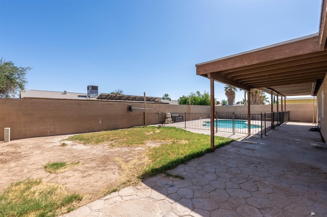 2931 W 20th St, Yuma, AZ 85364 - fenced backyard with a patio and central AC unit