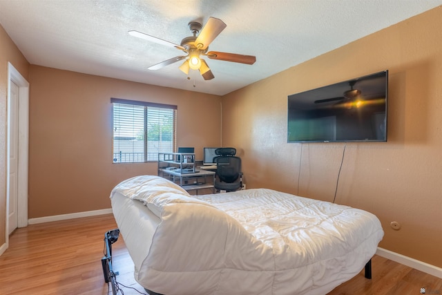 2931 W 20th St, Yuma, AZ 85364 - bedroom with light wood-type flooring, baseboards, a ceiling fan, and a textured ceiling