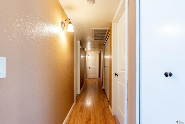 2931 W 20th St, Yuma, AZ 85364 - hallway with light wood-type flooring and baseboards