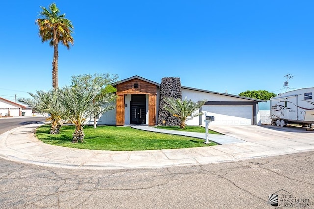 view of front of house with a front lawn and stucco siding