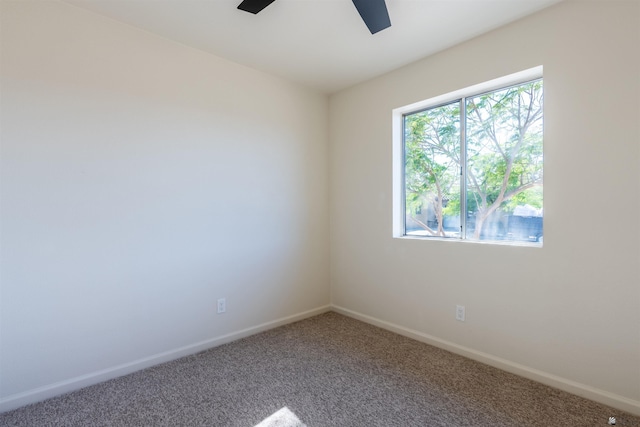 unfurnished room featuring baseboards, carpet flooring, and ceiling fan