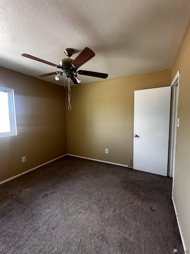 1527 E 23rd St, Yuma, AZ 85364 - carpeted spare room with baseboards, a textured ceiling, and ceiling fan