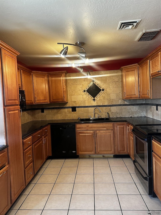1527 E 23rd St, Yuma, AZ 85364 - kitchen featuring dark countertops, stainless steel electric range oven, visible vents, and dishwasher