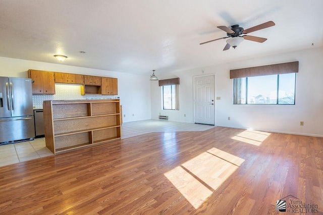 13125 E 51st Ln, Yuma, AZ 85367 - unfurnished living room with light wood-type flooring and ceiling fan