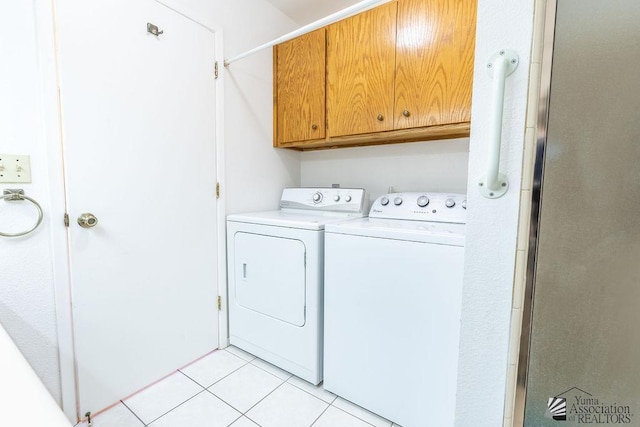 13125 E 51st Ln, Yuma, AZ 85367 - washroom featuring light tile patterned floors, cabinet space, and washer and clothes dryer
