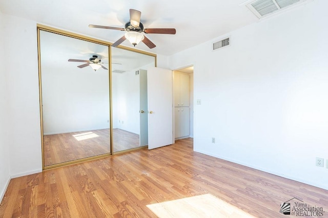 13125 E 51st Ln, Yuma, AZ 85367 - unfurnished bedroom featuring a ceiling fan, a closet, wood finished floors, and visible vents