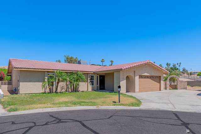 1850 W 15th Ln, Yuma, AZ 85364 - ranch-style home with stucco siding, an attached garage, driveway, a front lawn, and a tiled roof