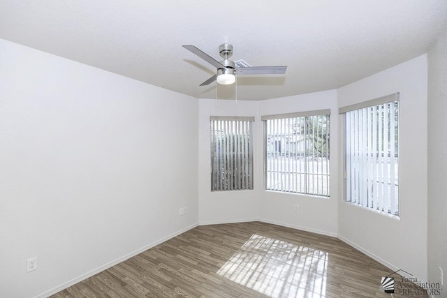 11760 E 28th Pl, Yuma, AZ 85367 - spare room featuring baseboards, a ceiling fan, and wood finished floors