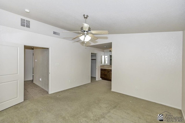 11760 E 28th Pl, Yuma, AZ 85367 - spare room with baseboards, ceiling fan, light carpet, and visible vents