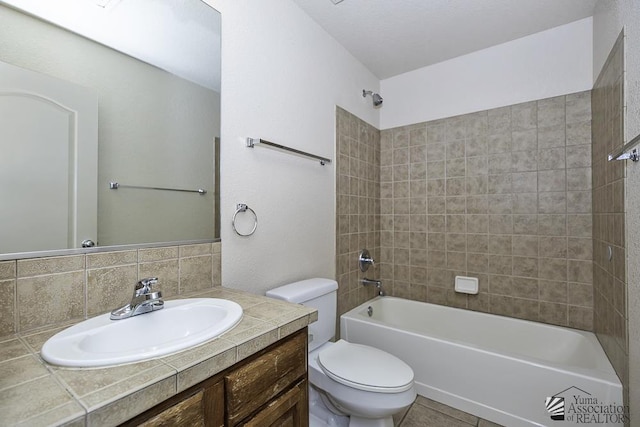 11760 E 28th Pl, Yuma, AZ 85367 - bathroom featuring vanity,  shower combination, toilet, and tasteful backsplash