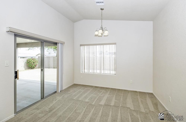 11760 E 28th Pl, Yuma, AZ 85367 - carpeted empty room featuring baseboards, lofted ceiling, a chandelier, and visible vents