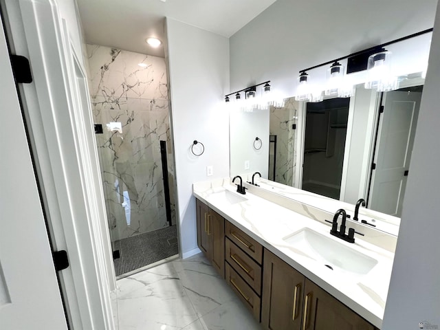 bathroom featuring marble look tiles, a marble finish shower, double vanity, and baseboards