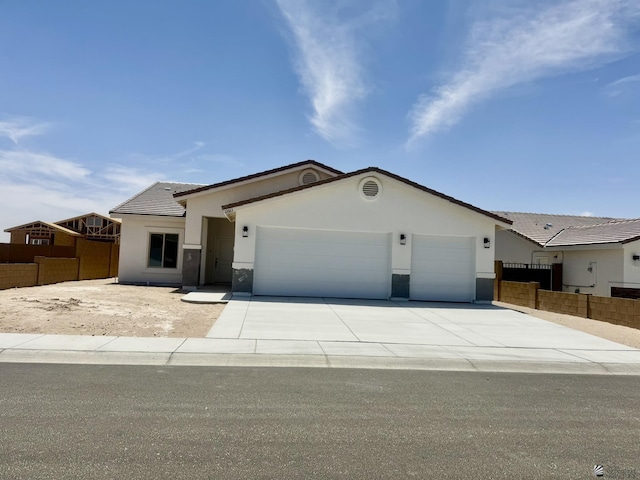 12683 E 51st St, Yuma, AZ 85367 - ranch-style house featuring a garage, concrete driveway, fence, and stucco siding