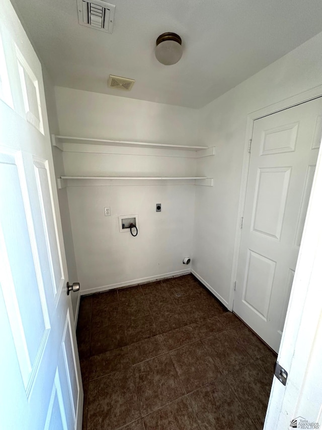 laundry room with laundry area, hookup for a washing machine, visible vents, and electric dryer hookup