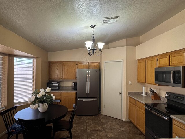 6348 E 45th St, Yuma, AZ 85365 - kitchen with appliances with stainless steel finishes, a textured ceiling, lofted ceiling, a chandelier, and brown cabinetry