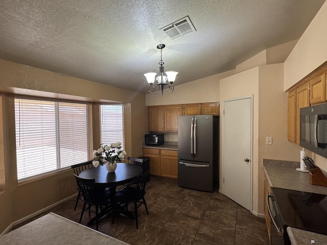 6348 E 45th St, Yuma, AZ 85365 - dining room featuring a chandelier, a textured ceiling, and baseboards