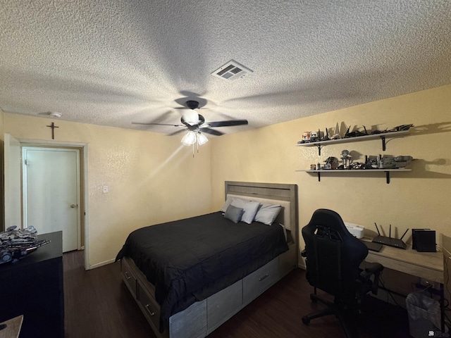 6348 E 45th St, Yuma, AZ 85365 - bedroom with dark wood-style floors, a textured ceiling, ceiling fan, and an office area