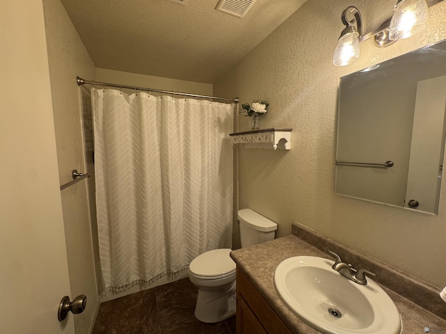 6348 E 45th St, Yuma, AZ 85365 - full bathroom featuring vanity, toilet, a textured wall, and a textured ceiling