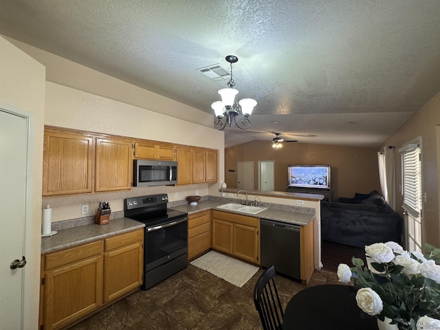 6348 E 45th St, Yuma, AZ 85365 - kitchen with dishwashing machine, black / electric stove, stainless steel microwave, a sink, and vaulted ceiling