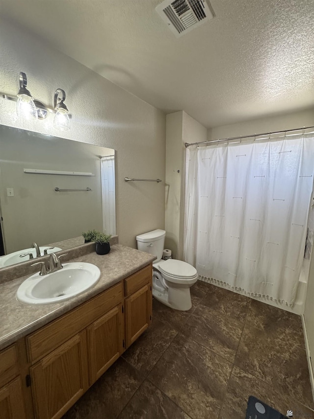 6348 E 45th St, Yuma, AZ 85365 - full bath featuring vanity, toilet, a textured ceiling, and a shower with curtain