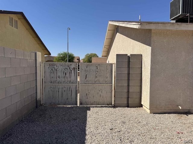 6348 E 45th St, Yuma, AZ 85365 - gate featuring central AC unit