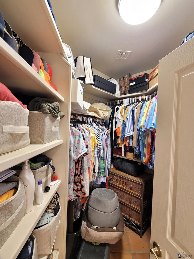 spacious closet with visible vents and tile patterned floors