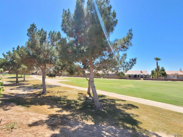 view of home's community featuring a lawn