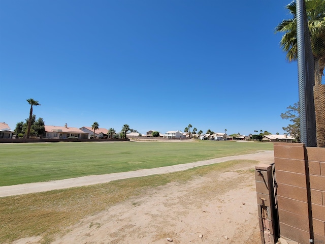 view of home's community with a residential view and a yard