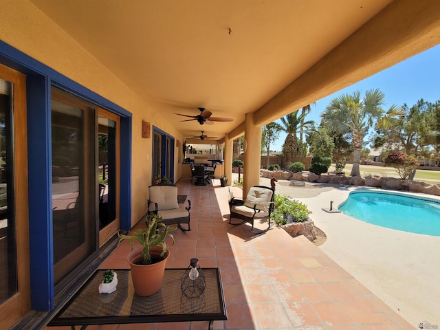 view of pool with a fenced in pool, a ceiling fan, outdoor dining space, and a patio area