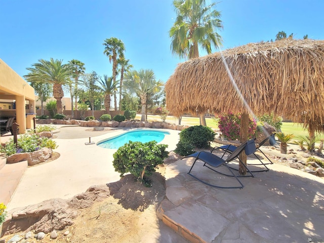 view of pool featuring a fenced in pool and a patio