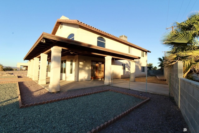 1565 W Vicky Ln, Yuma, AZ 85364 - back of property featuring a patio, stucco siding, a chimney, and fence