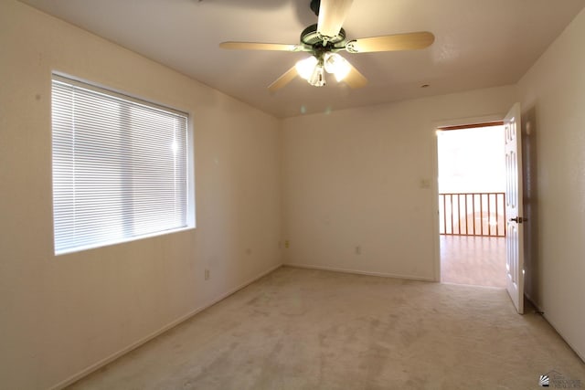 1565 W Vicky Ln, Yuma, AZ 85364 - spare room featuring a ceiling fan, baseboards, and light carpet