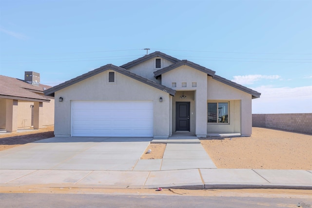 10858 E 45th St, Yuma, AZ 85367 - single story home featuring an attached garage, concrete driveway, and stucco siding