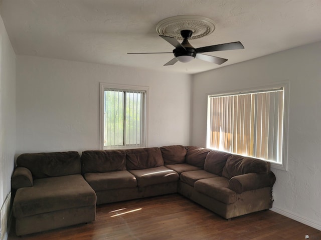 1995 S 10th Ave, Yuma, AZ 85364 - living room featuring baseboards, a ceiling fan, and wood finished floors