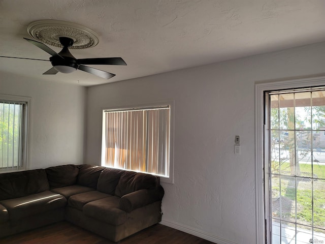 1995 S 10th Ave, Yuma, AZ 85364 - living room with a ceiling fan, baseboards, and wood finished floors