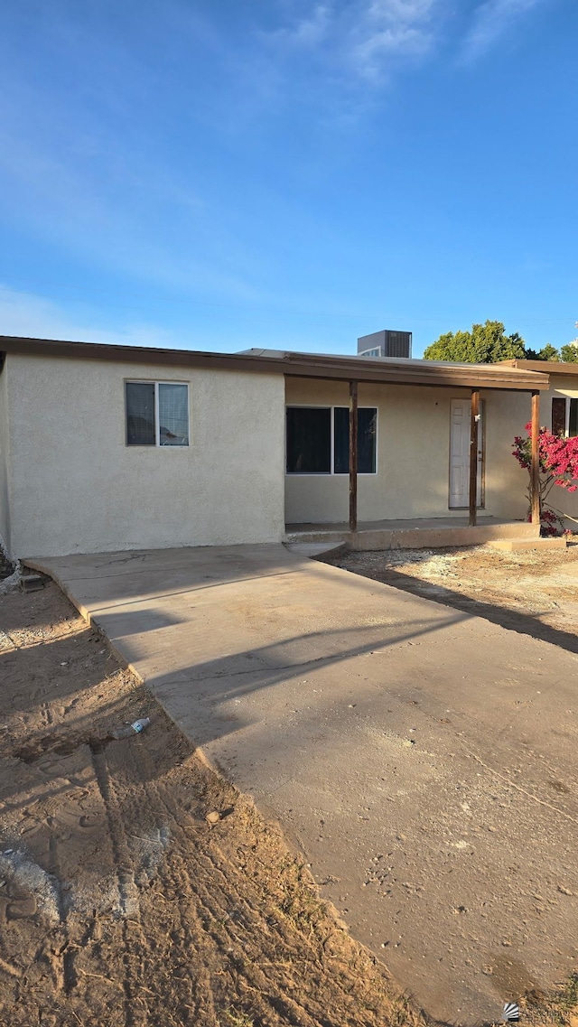 ranch-style home with stucco siding
