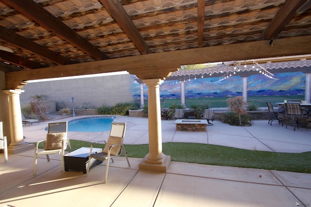 6767 E Mountain View Pl, Yuma, AZ 85365 - view of patio with a fenced in pool, an outdoor fire pit, and fence