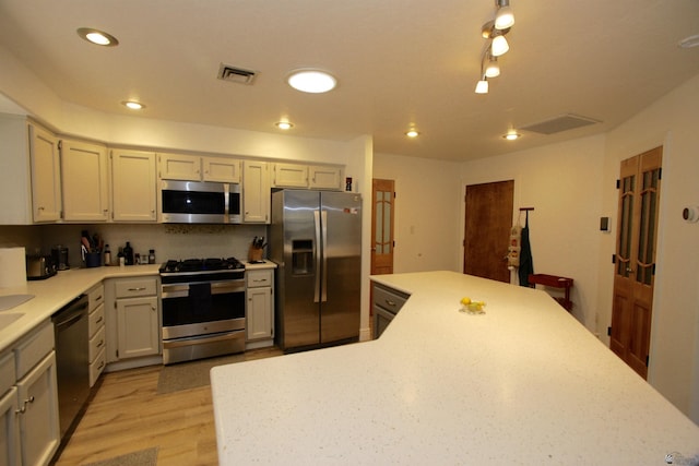 6767 E Mountain View Pl, Yuma, AZ 85365 - kitchen featuring visible vents, recessed lighting, light countertops, light wood-style flooring, and stainless steel appliances