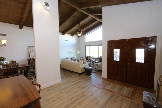 6767 E Mountain View Pl, Yuma, AZ 85365 - foyer featuring high vaulted ceiling, light wood-style flooring, ceiling fan with notable chandelier, beamed ceiling, and wood ceiling