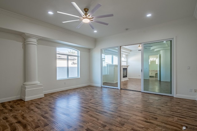 unfurnished bedroom featuring crown molding, ornate columns, and dark wood-style floors