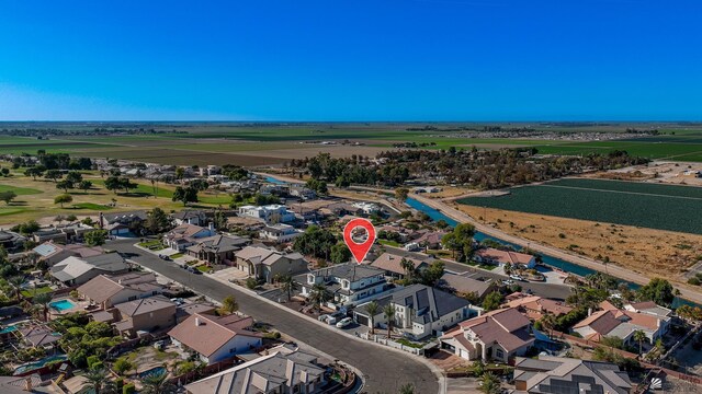 birds eye view of property with a residential view