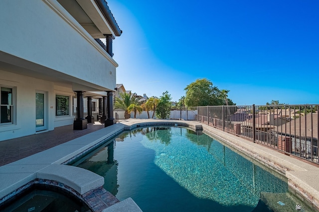 view of pool with a fenced in pool, a patio, a jacuzzi, and a fenced backyard