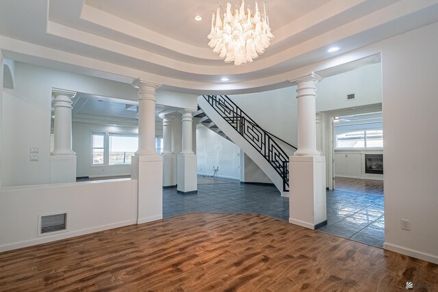 foyer entrance featuring dark wood-style flooring, stairway, visible vents, and recessed lighting